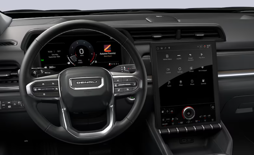 Driver view of a GMC Denali SUV interior with a large vertical touchscreen at Anderson Buick GMC of Hunt Valley